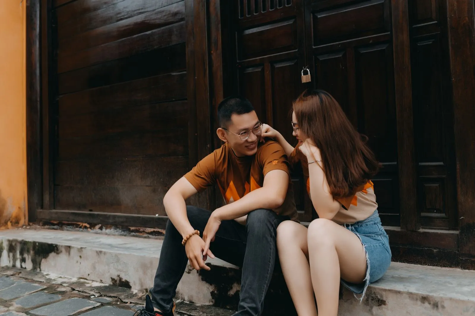 A cheerful Asian couple talking and smiling together