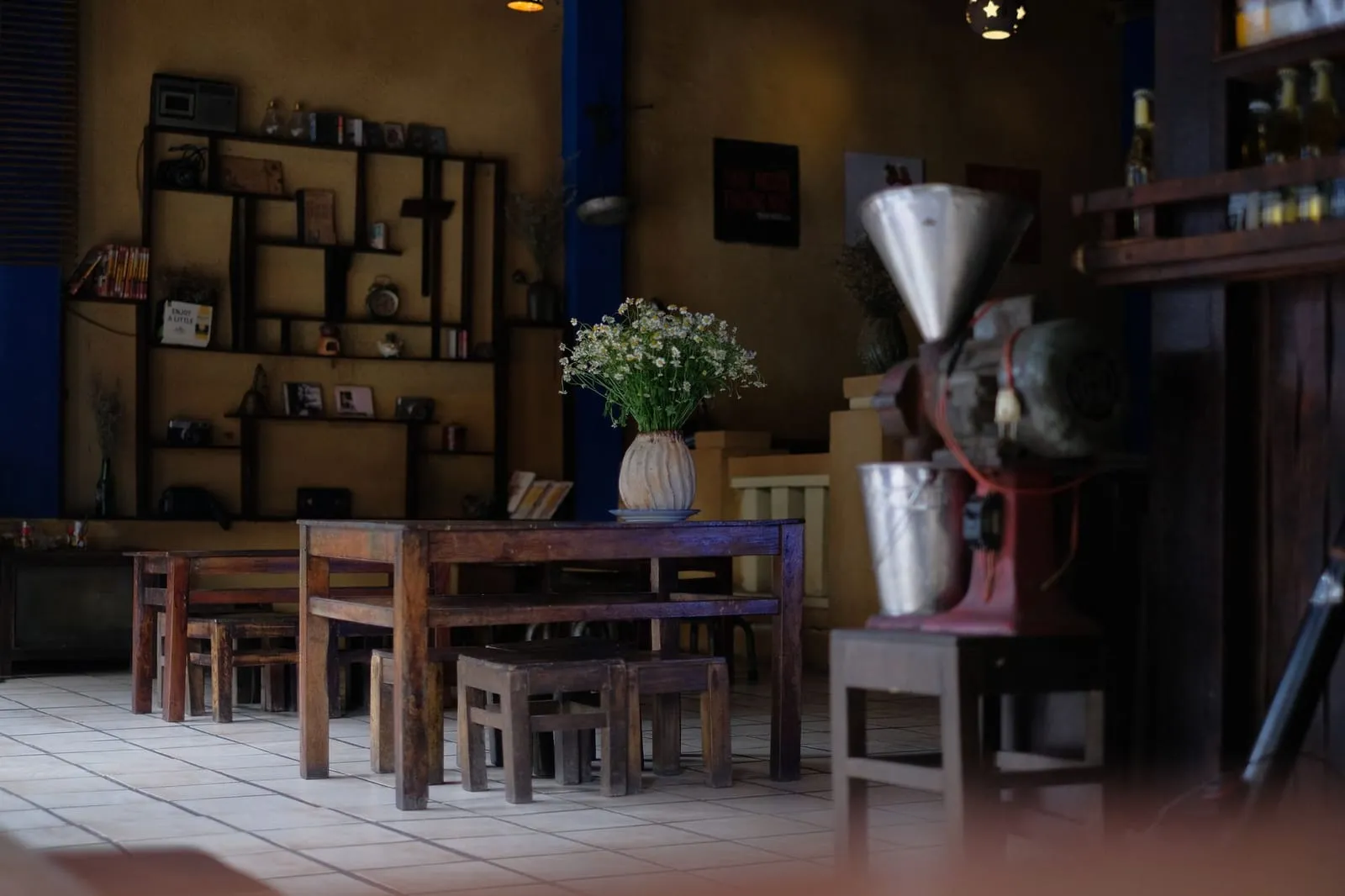 A quiet café interior at sunset with gentle light and cozy atmosphere.