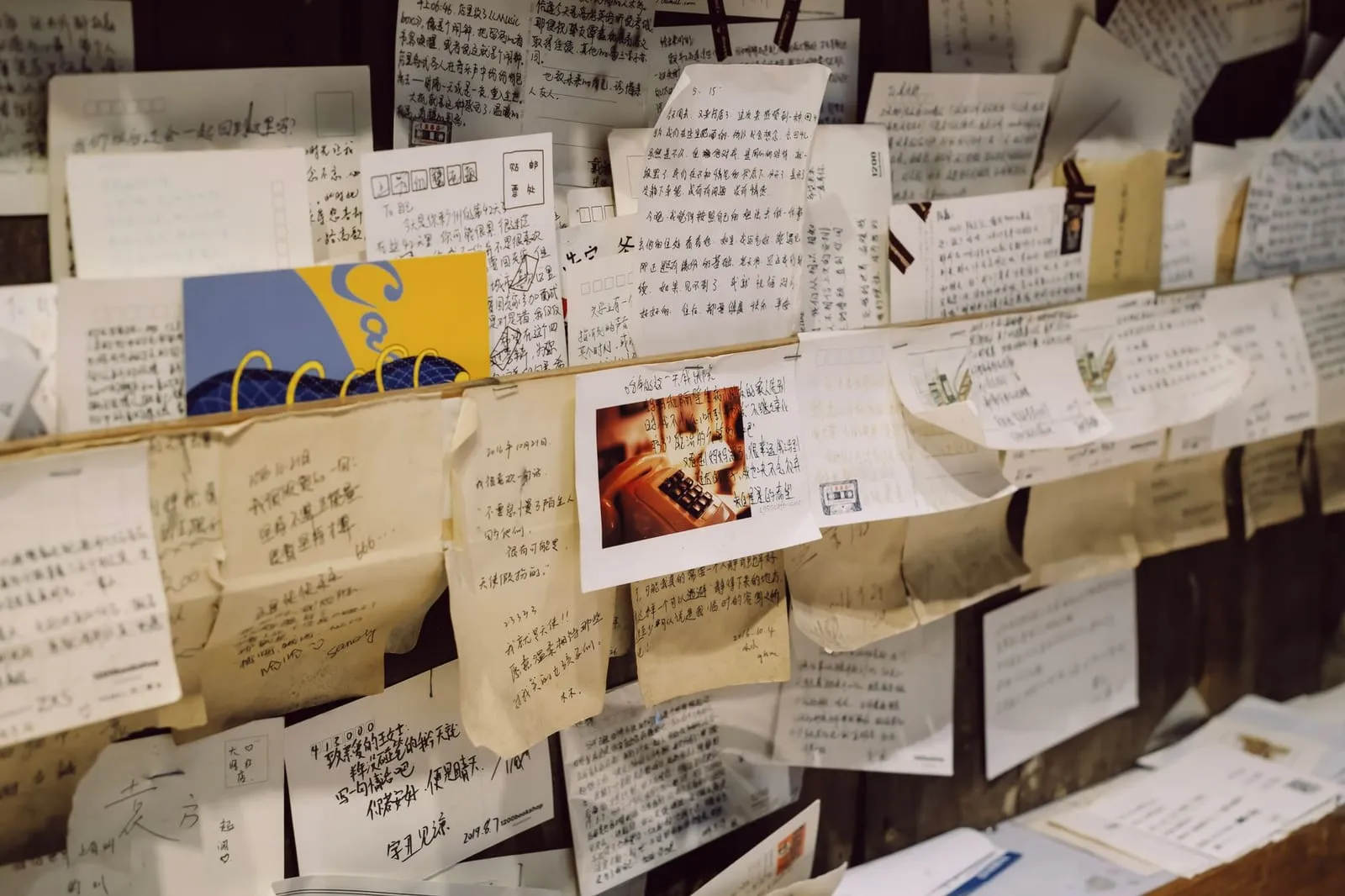 A cozy cafe interior with handwritten notes on the wall, symbolizing personal stories.