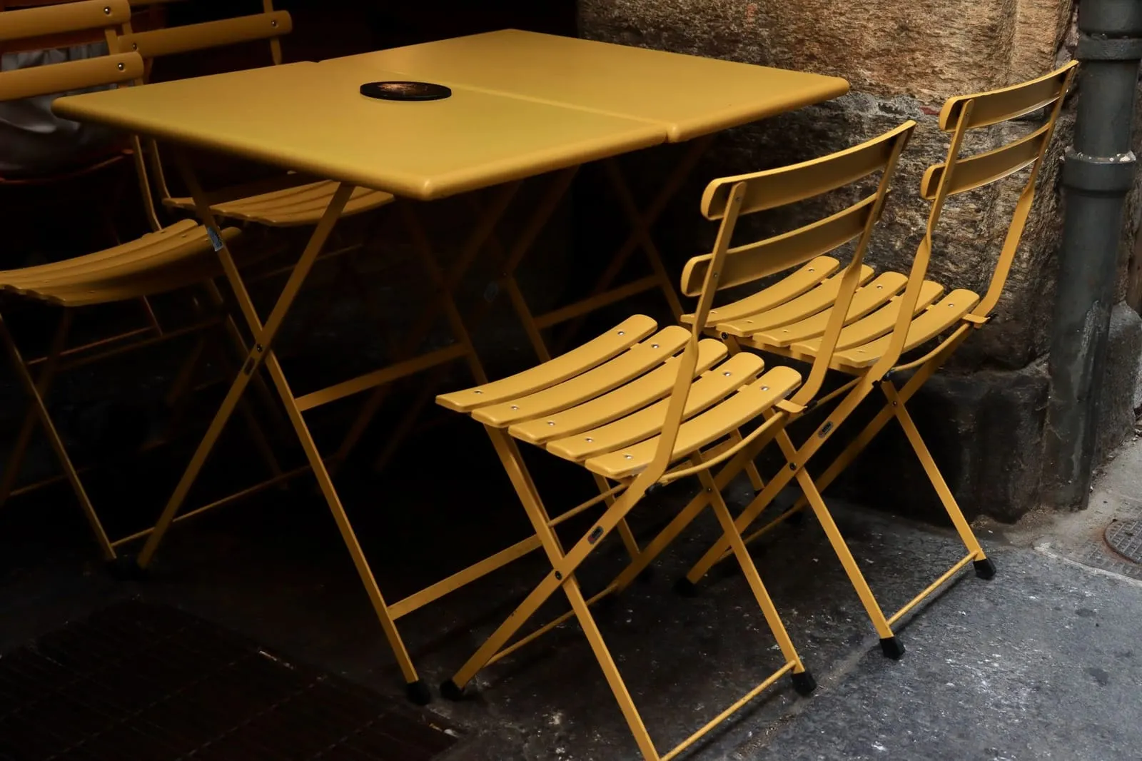 A cozy café table set for two in an international city, evoking connection and conversation.
